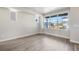 Bright Living Room with light gray wood flooring and large windows at 6940 Clay St, Denver, CO 80221