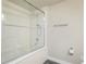 Shower with glass door, rainfall shower head and tiled wall at 6940 Clay St, Denver, CO 80221