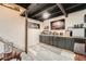 Finished basement features a bar area with ample counter space and storage at 8007 S Dover St, Littleton, CO 80128