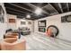 Finished basement features a cozy sitting area with neutral walls and stylish furniture at 8007 S Dover St, Littleton, CO 80128
