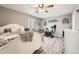 Cozy bedroom with wood floors, ceiling fan, and dedicated workout space at 8007 S Dover St, Littleton, CO 80128
