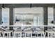 Kitchen with breakfast bar featuring granite countertops, stainless appliances, and access to the backyard at 8007 S Dover St, Littleton, CO 80128