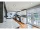 Modern kitchen featuring granite countertops, stainless appliances, a subway tile backsplash, and ample storage at 8007 S Dover St, Littleton, CO 80128