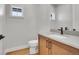 Modern bathroom with light wood vanity and a single sink at 359 Castlemaine Ct, Castle Rock, CO 80104