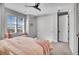 Cozy bedroom with built-in shelves, window seat, and soft bedding at 359 Castlemaine Ct, Castle Rock, CO 80104