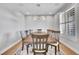 Formal dining room with hardwood floors, large windows, and a beautiful chandelier at 359 Castlemaine Ct, Castle Rock, CO 80104