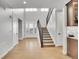 Bright and spacious entryway with hardwood floors and modern staircase at 359 Castlemaine Ct, Castle Rock, CO 80104