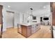 Open concept kitchen with large island, wine cooler, and stainless steel appliances at 359 Castlemaine Ct, Castle Rock, CO 80104