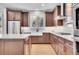 Well-appointed kitchen with farmhouse sink, custom cabinetry, and stainless steel appliances at 359 Castlemaine Ct, Castle Rock, CO 80104