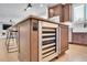 Kitchen island with built-in wine cooler and ample counter space at 359 Castlemaine Ct, Castle Rock, CO 80104