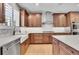 Modern kitchen features white quartz countertops and stainless steel appliances at 359 Castlemaine Ct, Castle Rock, CO 80104