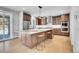 Modern kitchen with an island, stainless steel appliances, and hardwood floors at 359 Castlemaine Ct, Castle Rock, CO 80104