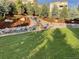 Landscaped backyard with tiered retaining wall and waterfall at 359 Castlemaine Ct, Castle Rock, CO 80104