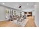 Bright living room features hardwood floors, comfy seating, and an open floor plan at 359 Castlemaine Ct, Castle Rock, CO 80104