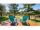 Outdoor deck featuring comfortable seating and scenic views of the surrounding nature and mountains at 21868 Mountsfield Dr, Golden, CO 80401