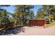 Two-car garage featuring a brick exterior and spacious driveway, providing ample parking and storage at 21868 Mountsfield Dr, Golden, CO 80401