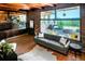 Bright living room features large windows offering picturesque mountain views and outdoor seating at 21868 Mountsfield Dr, Golden, CO 80401