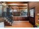 Inviting living space provides seamless flow with wood accents and a glimpse into the adjoining kitchen at 21868 Mountsfield Dr, Golden, CO 80401