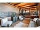 Interior living space features stylish design with brick walls, tile floors and unique iron railings at 21868 Mountsfield Dr, Golden, CO 80401