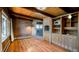 Living room with fireplace, exposed beam ceiling and hardwood floors at 21868 Mountsfield Dr, Golden, CO 80401