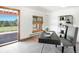 Bright office featuring a modern desk, built-in bookshelves and outdoor views at 21868 Mountsfield Dr, Golden, CO 80401