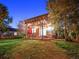 Evening view of backyard patio with pergola, string lights, and seating area at 23802 E 2Nd Dr, Aurora, CO 80018