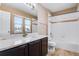 Bathroom with granite countertop and shower/tub combo at 23802 E 2Nd Dr, Aurora, CO 80018