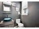 Stylish powder room with a modern sink and toilet at 23802 E 2Nd Dr, Aurora, CO 80018