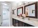 Double vanity bathroom with granite countertops and large mirrors at 23802 E 2Nd Dr, Aurora, CO 80018