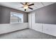 Grey bedroom with ceiling fan and window at 23802 E 2Nd Dr, Aurora, CO 80018