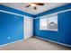 Blue bedroom with ceiling fan and window at 23802 E 2Nd Dr, Aurora, CO 80018