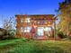 Two-story house exterior with backyard patio and pergola at night at 23802 E 2Nd Dr, Aurora, CO 80018