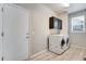 Convenient laundry room with washer, dryer, and cabinets at 23802 E 2Nd Dr, Aurora, CO 80018