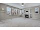 Spacious living room featuring a fireplace and ample natural light at 23802 E 2Nd Dr, Aurora, CO 80018