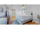 Comfortable bedroom with hardwood floors and a modern dresser at 1777 Larimer St # 1608, Denver, CO 80202