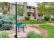 Exterior view of a well-maintained multi-Gathering building with manicured landscaping and mature trees at 4400 S Quebec St # 105K, Denver, CO 80237