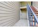 Ground-level entrance of this multi-Gathering building showing the stairs leading to upper units at 4400 S Quebec St # 105K, Denver, CO 80237