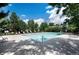 Community pool with lounge chairs and shade trees provides a relaxing outdoor space at 4400 S Quebec St # 105K, Denver, CO 80237