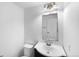 Bathroom featuring a vanity with a white sink and a large mirror at 4940 Akron St, Denver, CO 80238