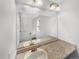 Bathroom mirror reflecting double sinks and modern finishes and lighting at 4940 Akron St, Denver, CO 80238