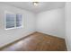 Bedroom featuring neutral carpet and a basement window at 4940 Akron St, Denver, CO 80238