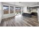 Bright living space with a modern kitchen island and stainless appliances at 4940 Akron St, Denver, CO 80238