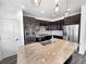 Modern kitchen with stainless steel appliances, granite countertops, and ample cabinet space at 4940 Akron St, Denver, CO 80238
