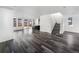 Open-concept living area with a staircase and views of the kitchen at 4940 Akron St, Denver, CO 80238