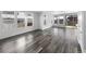 Spacious living room with large windows and wood flooring at 4940 Akron St, Denver, CO 80238