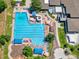 Enjoy this aerial view of the bright blue community pool with slide and many happy people at 18 Blue Sage, Littleton, CO 80127