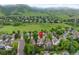 Aerial view of neighborhood with view of property's surroundings, highlighting green spaces and mountain backdrop at 18 Blue Sage, Littleton, CO 80127
