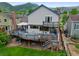 Multi-level wooden deck at rear of house, offering ample outdoor living space at 18 Blue Sage, Littleton, CO 80127