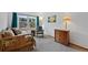 Bright bedroom with large window and cozy reading nook at 18 Blue Sage, Littleton, CO 80127