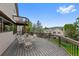 Entertain on this deck with ample seating and views of surrounding treed landscape at 18 Blue Sage, Littleton, CO 80127